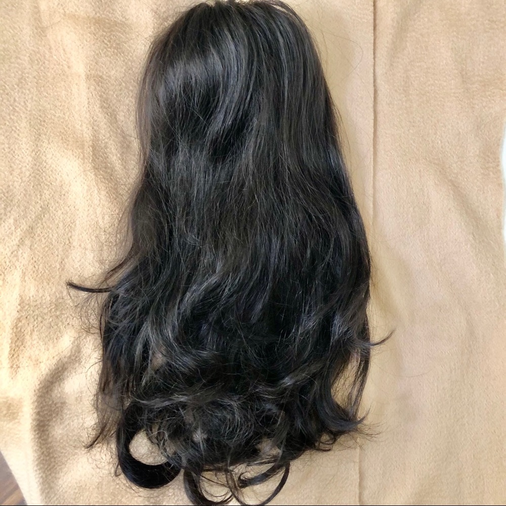 Synthetic clip on ponytail.